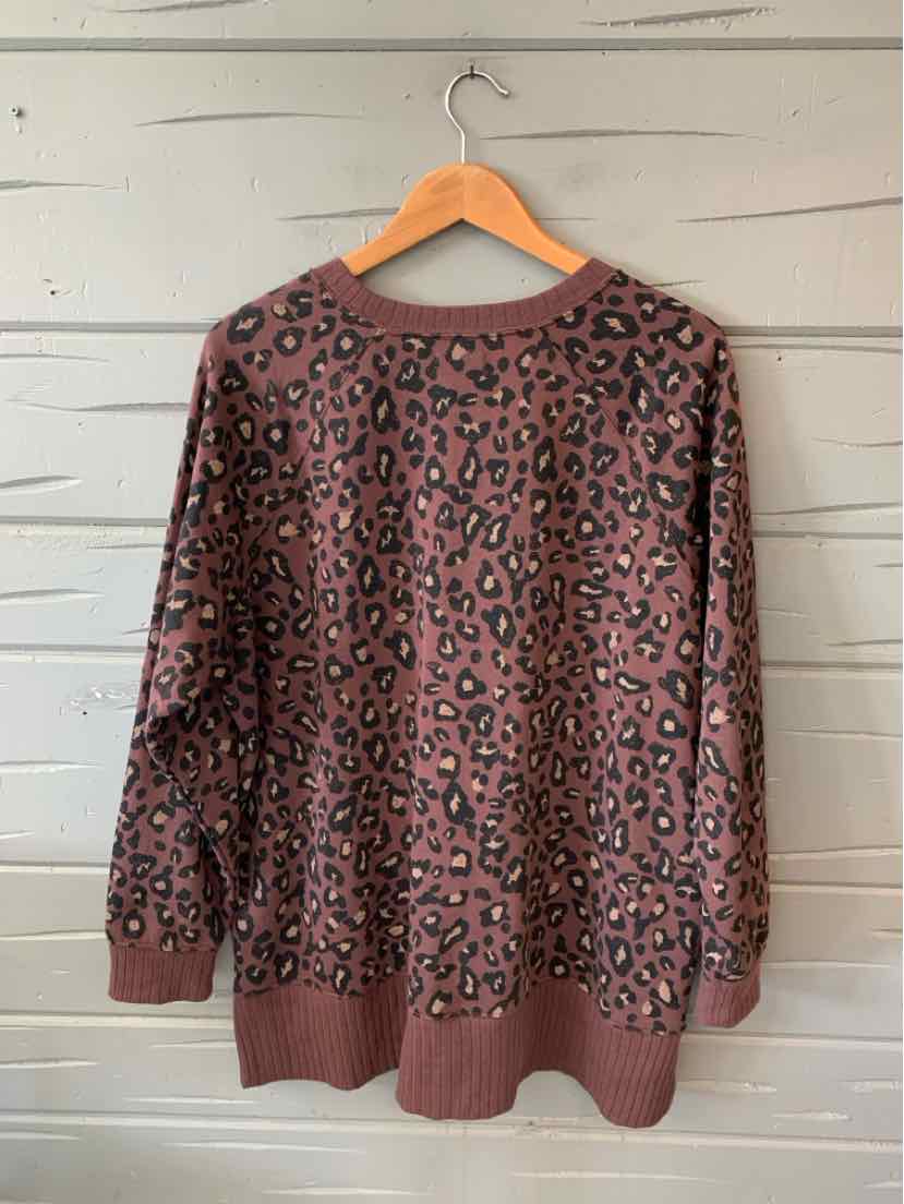 Long-sleeve brown sweater with black leopard print, ribbed cuffs and hem, relaxed fit, size XL.
