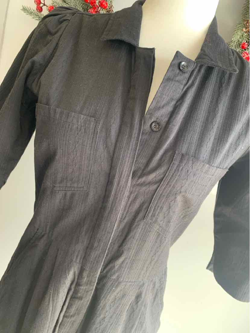Black long-sleeve button-up shirt with collar and gathered waist detail in size XS.