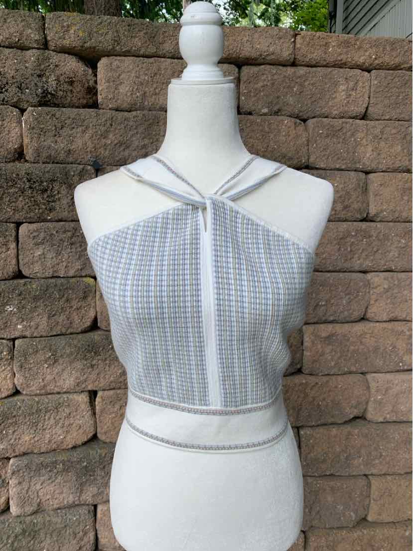 Light blue and white checkered knit halter top with crisscross straps and cropped fit on mannequin.