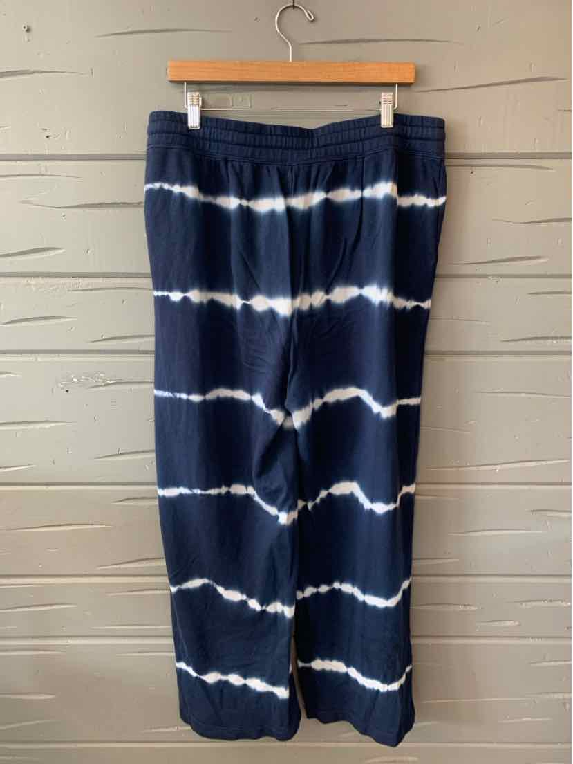 Navy blue wide-leg pants with white horizontal tie-dye stripes and elastic waistband.