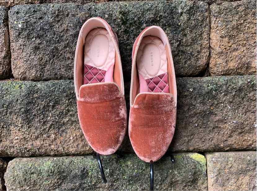 Pair of dusty rose velvet slip-on flats with rounded toes and quilted insoles, size 6.5.