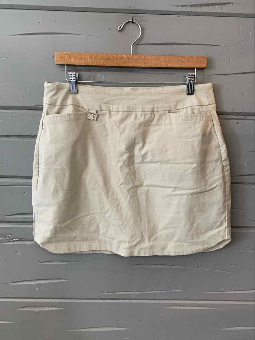 Tan cotton mini skirt with side pockets and belt loops, size 10.