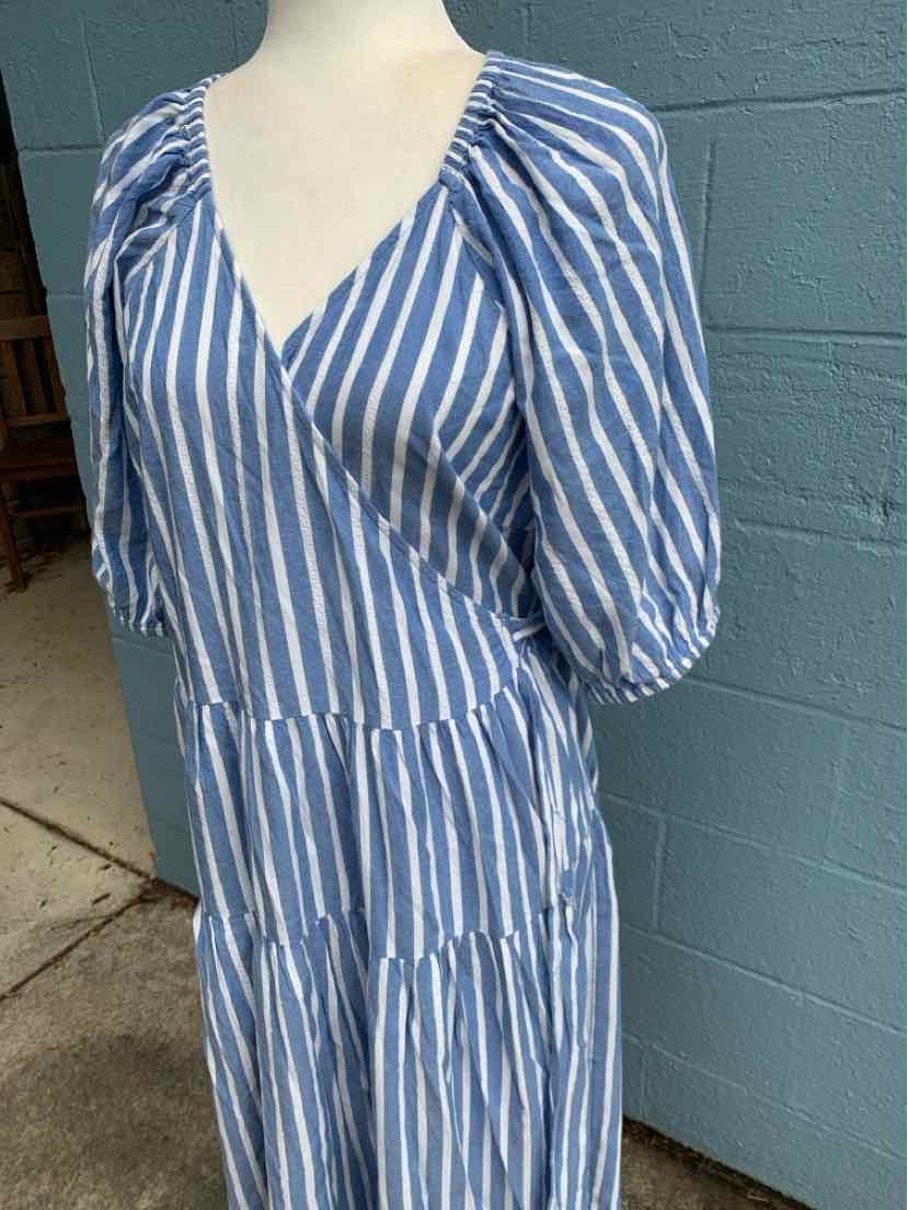 Blue and white vertical striped dress with puff sleeves and tiered skirt in large size.