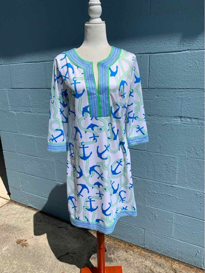 White knee-length dress with blue and green anchor print, green trim, and three-quarter sleeves.