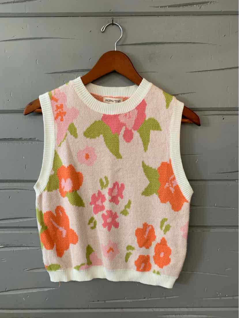 Sleeveless knit sweater vest with large floral patterns in pink, orange, and green on cream background.