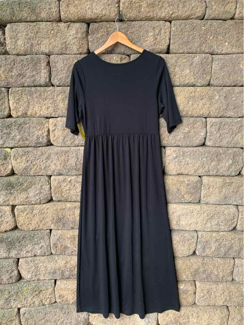 Black mid-length dress with half sleeves and a gathered waistline, made from soft fabric.
