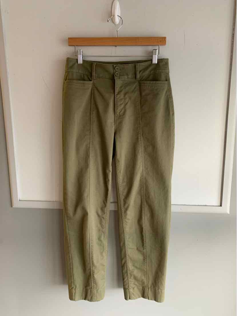 Olive green high-waist straight-leg pants with belt loops hanging on wooden hanger.