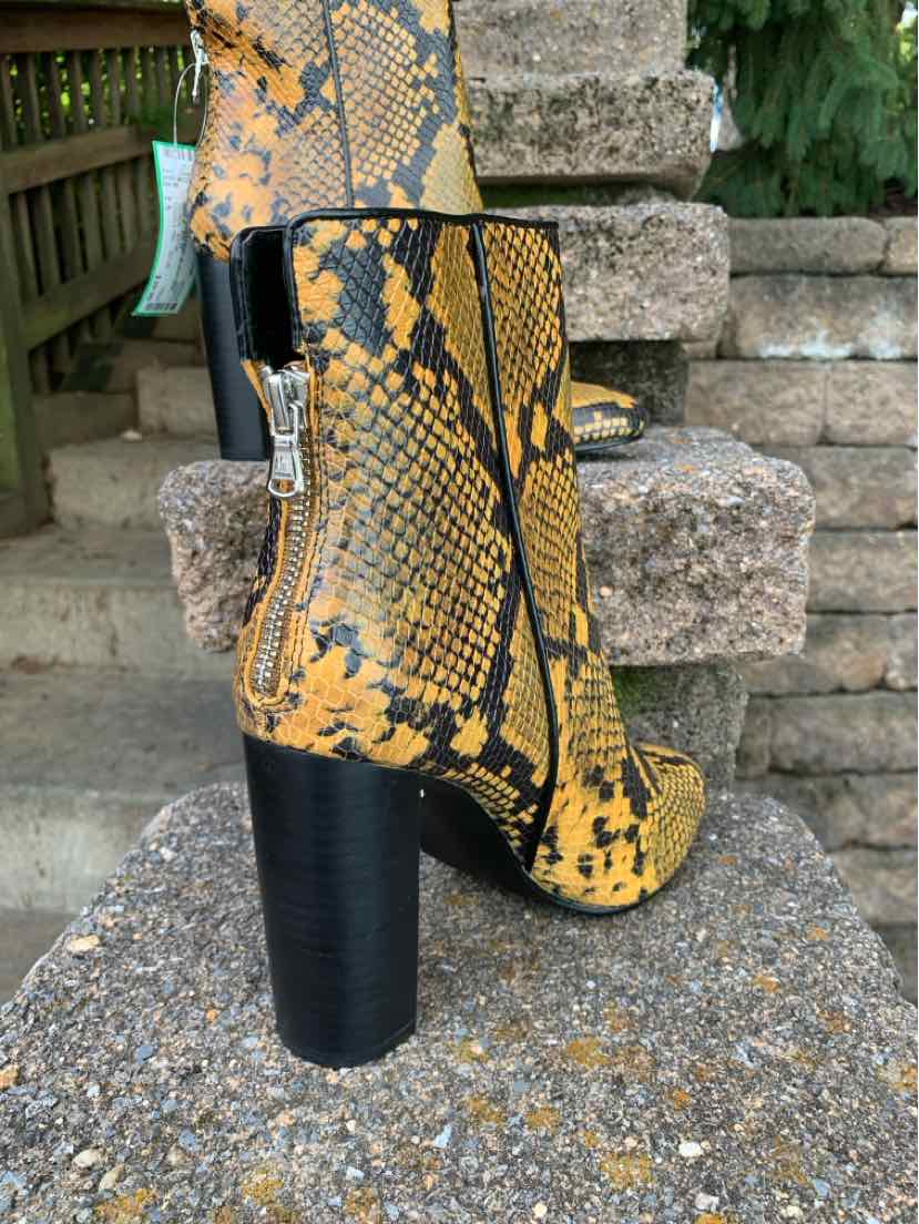 Yellow and black snake print ankle boot with chunky black heel and silver side zipper.