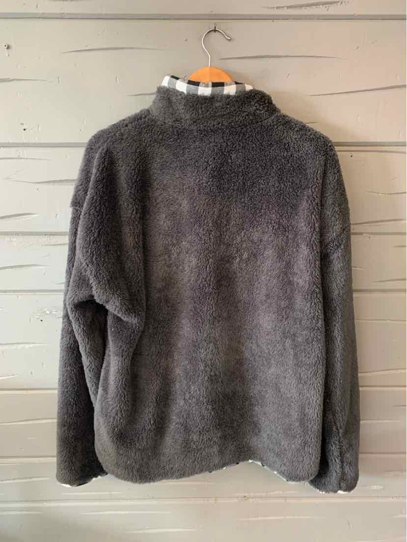 Gray oversized fleece pullover with high collar and long sleeves, size XL, hanging on wooden hanger.