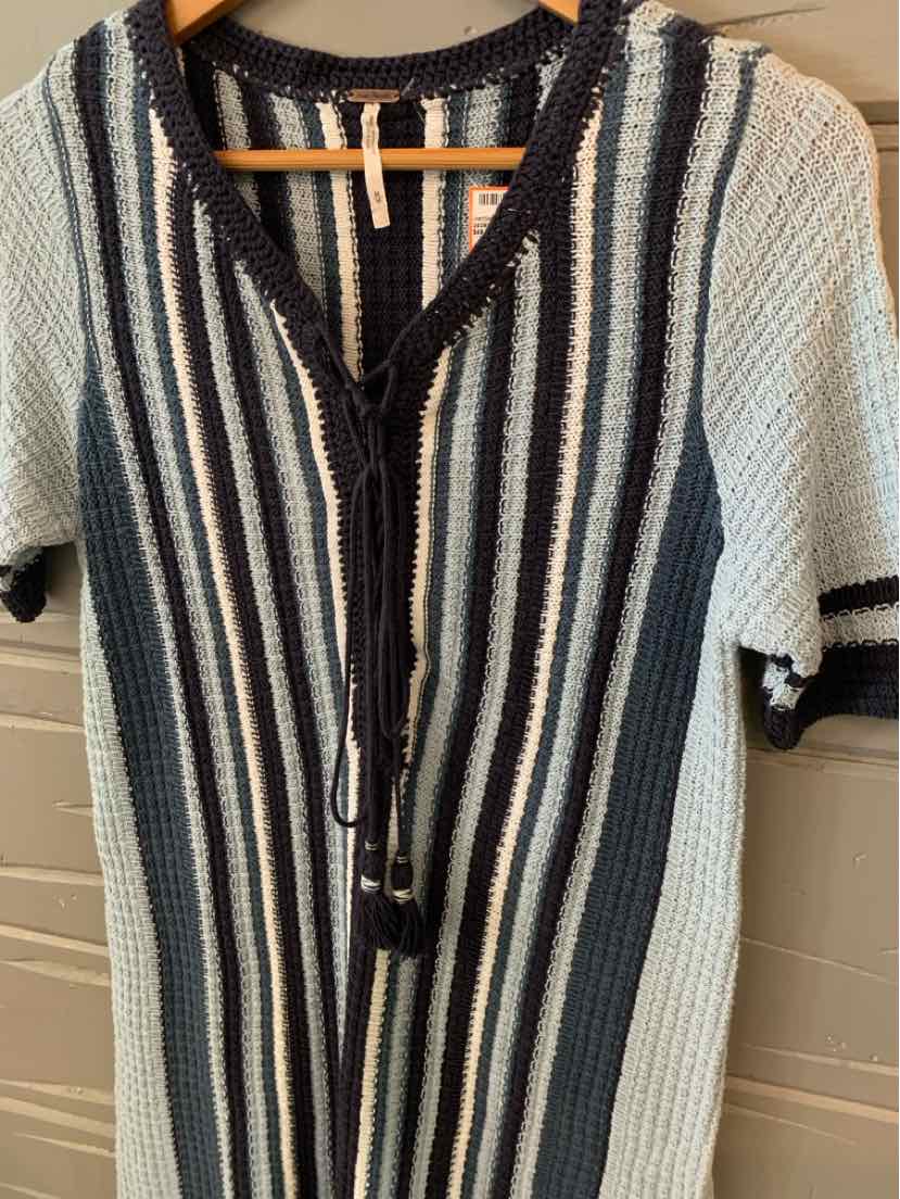 Knit dress with vertical navy and cream stripes, short sleeves, and a V-neck with black trim and front tie closure.