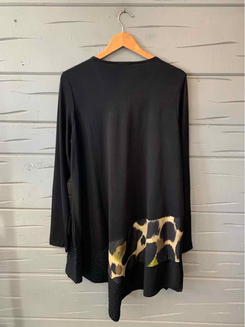 Black long-sleeve asymmetrical tunic with a draped hem and tan-and-black abstract print.