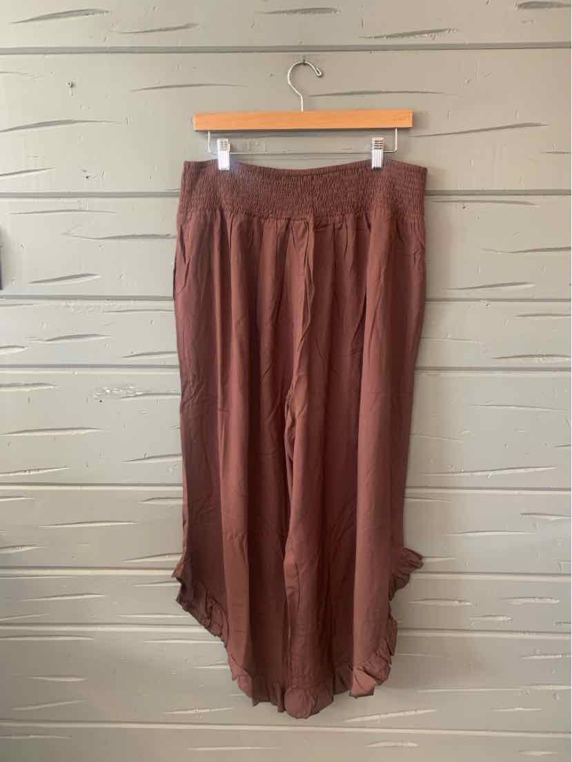 Brown flowy wide-leg pants with elastic waistband and ruffled hem, size 18-20.