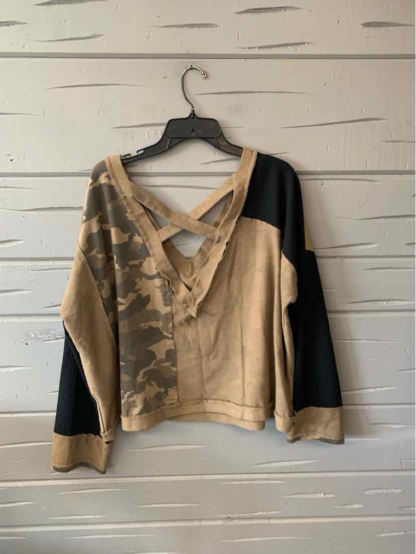 Women's cropped hoodie with beige, black, and camouflage paneling and a front zipper closure.