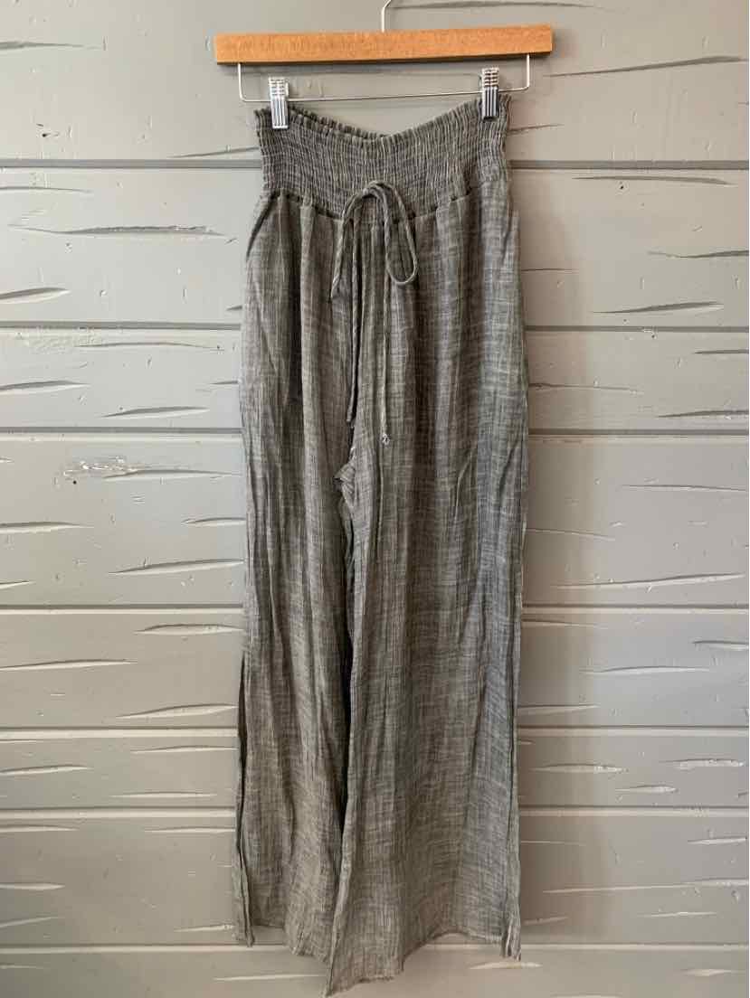 Gray wide-leg pants with a high smocked waistband and drawstring tie, lightweight fabric.