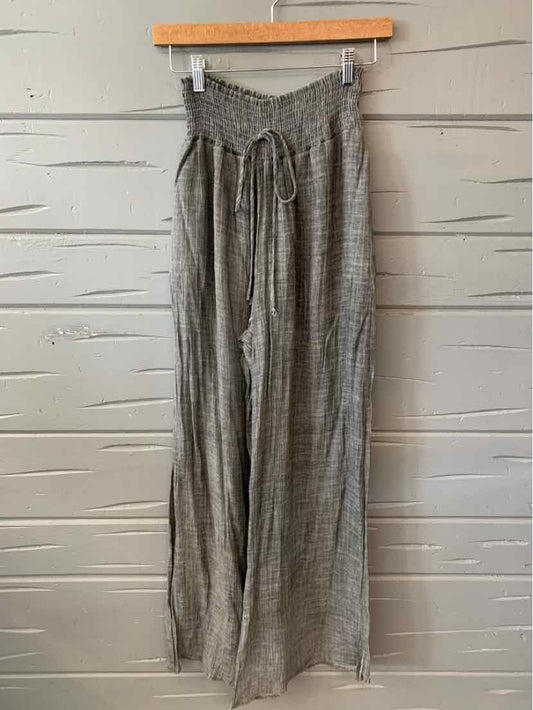 Gray wide-leg pants with a high smocked waistband and drawstring tie, lightweight fabric.