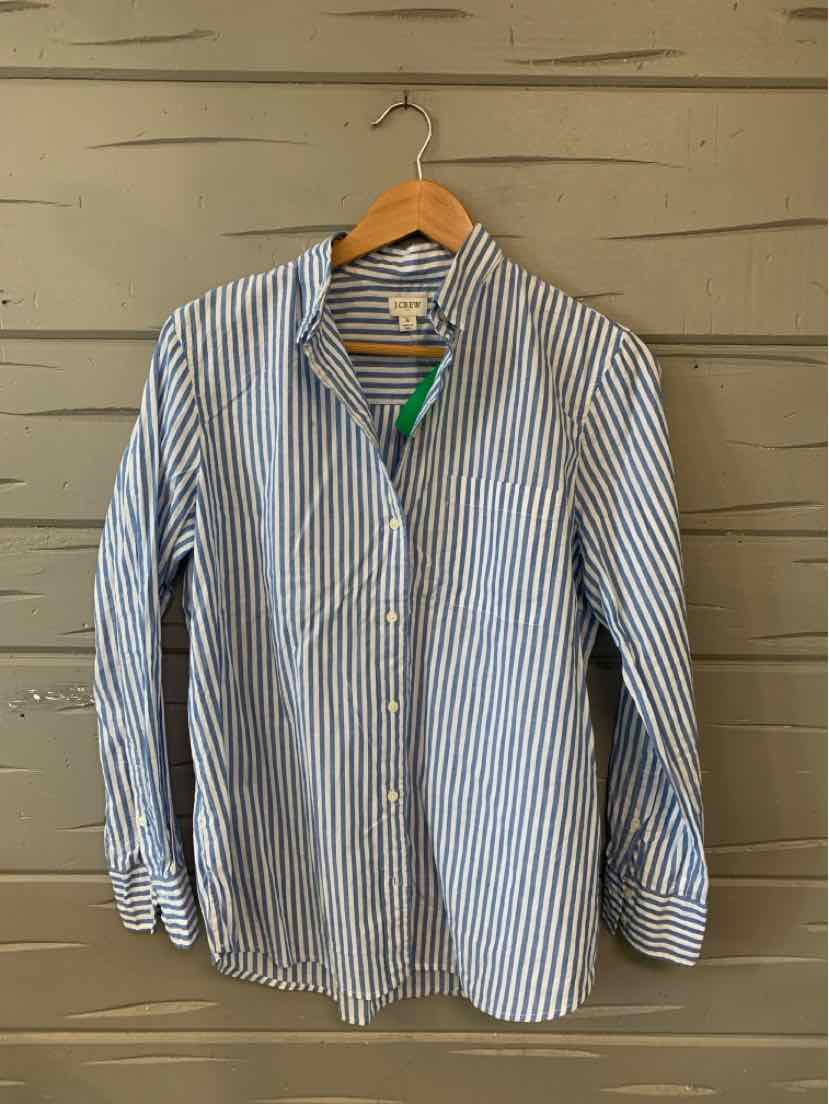 Blue and white vertical striped button-up shirt with long sleeves on wooden hanger.