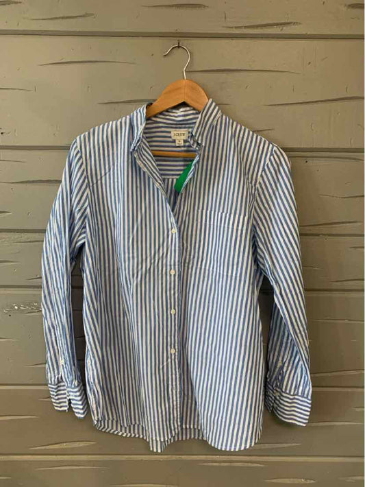 Blue and white vertical striped button-up shirt with long sleeves on wooden hanger.