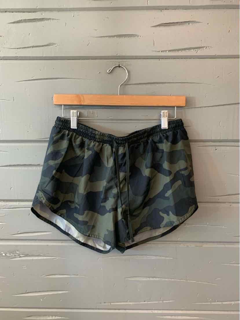 Dark green camo print women's athletic shorts with elastic waistband and drawstring.