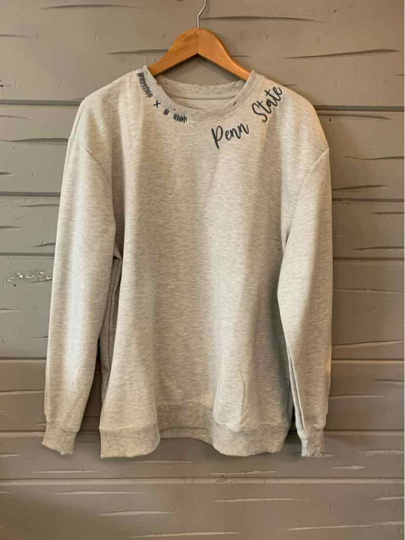 Light gray long-sleeve sweatshirt with ribbed cuffs and neckline, "Pleas Smile" text near collar in black cursive.