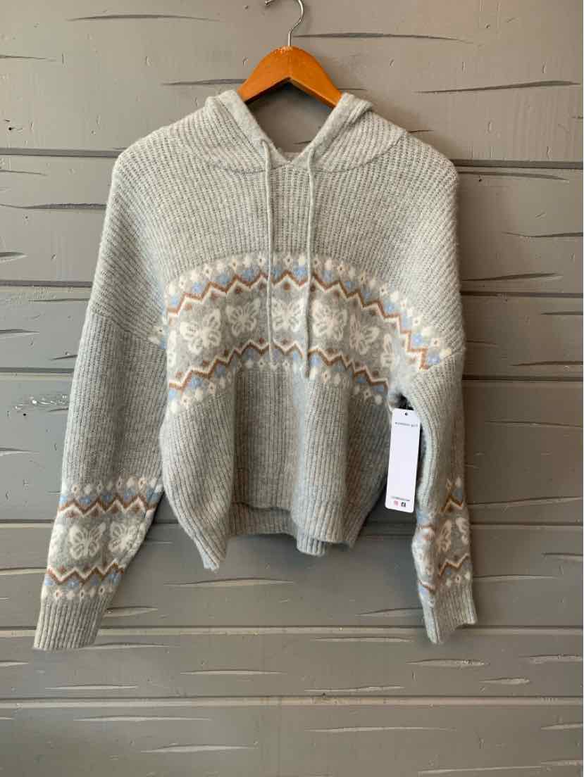 Light gray knit hooded sweater with white, beige, and light blue zigzag pattern across chest and sleeves, with drawstrings.