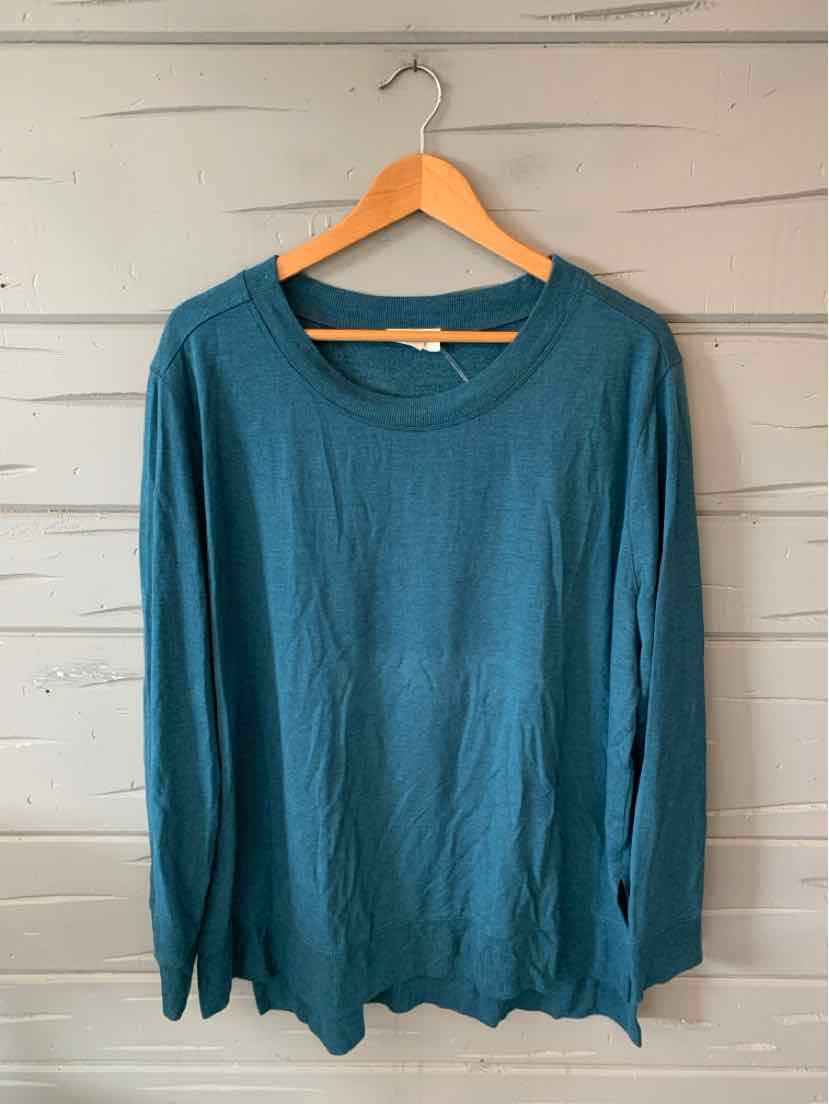 Teal long-sleeve crew neck sweater in soft knit fabric, size XL, hanging on wooden hanger.