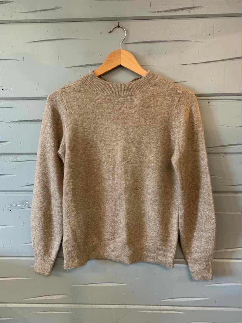 Soft brown metallic knit sweater with long sleeves and crew neck on wooden hanger.