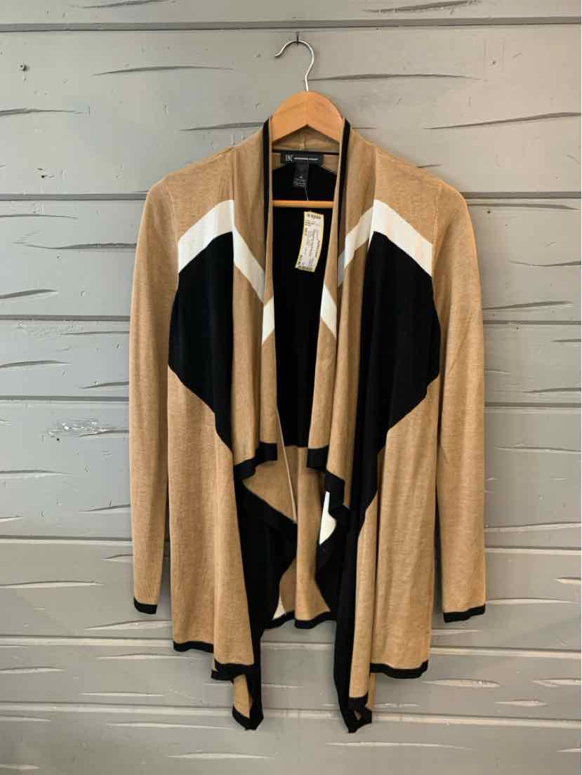 Tan open-front cardigan with black and white color block panels, draped collar, and long sleeves.