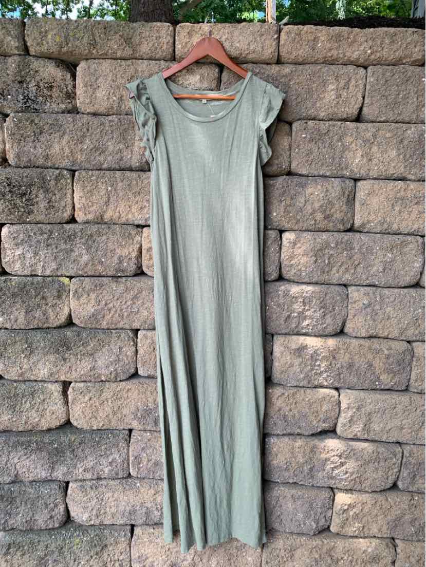 Long olive green maxi dress with short ruffled sleeves and a scoop neckline, hanging on wooden hanger.
