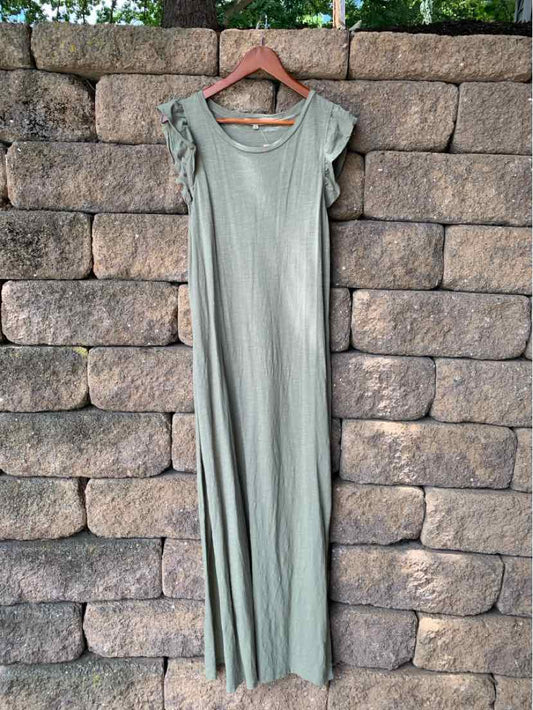 Long olive green maxi dress with short ruffled sleeves and a scoop neckline, hanging on wooden hanger.