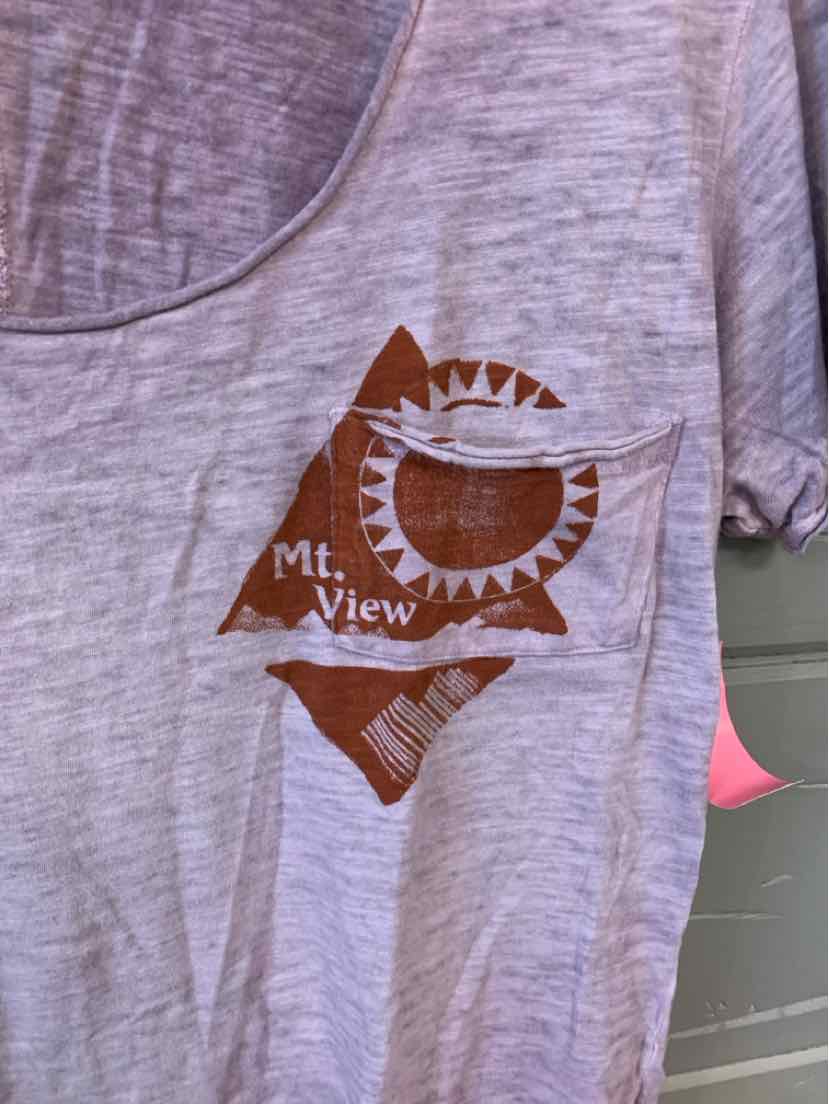 Light gray heathered T-shirt with brown geometric sun and mountain graphic and text "Mt. View" on front chest pocket area.