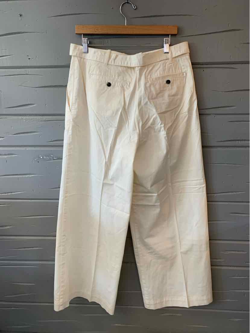 White wide-leg pants with high waist, two back pockets, and belt loops, size 12.