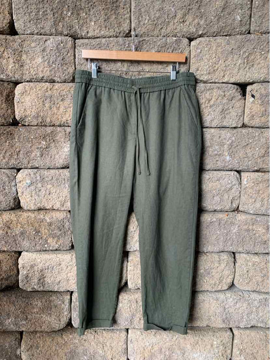 Olive green drawstring waist pants with side pockets and tapered legs, casual lightweight fabric.