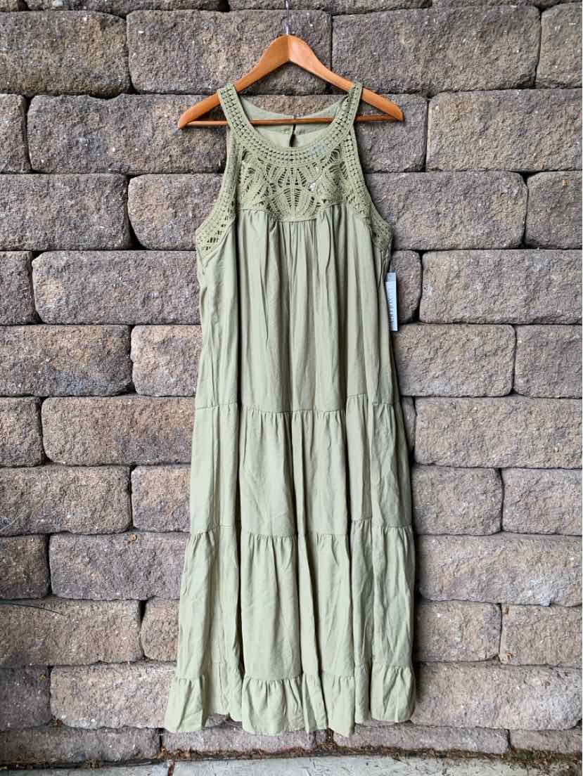 Sleeveless olive green maxi dress with tiered skirt and crochet lace yoke detail.