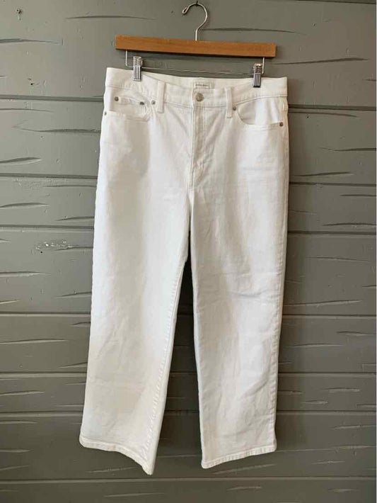 White denim jeans with straight-leg fit, five-pocket style, and belt loops, size 10.