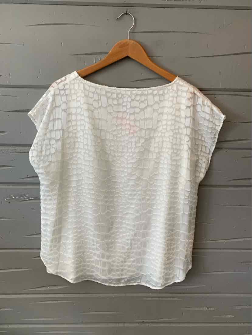 White Calvin Klein blouse with subtle textured pattern, wide neckline, and short sleeves, size large.