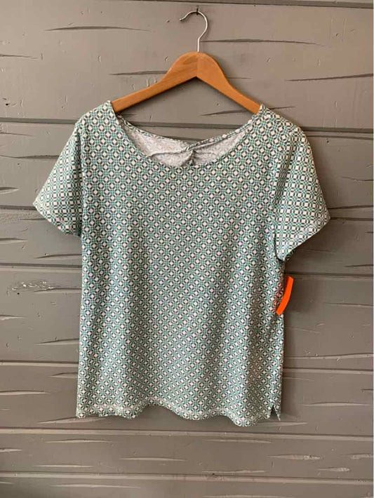 Light gray short-sleeve shirt with small white polka dots, scoop neckline, lightweight fabric.