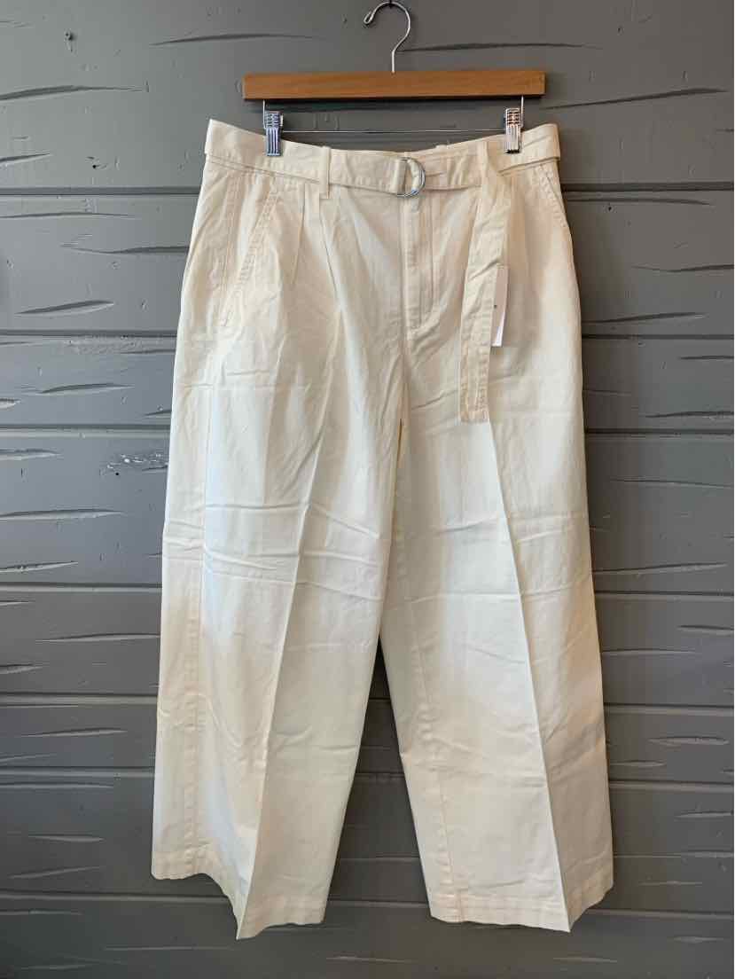High-waist white wide-leg pants with pleats and a matching fabric belt.