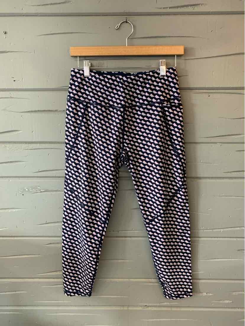 Black and white patterned leggings with a high waistband and ankle cuffs.