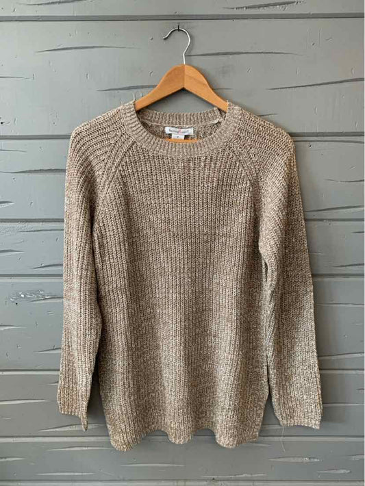 Beige marled knit crewneck sweater with long sleeves, medium size, hanging on wooden hanger.
