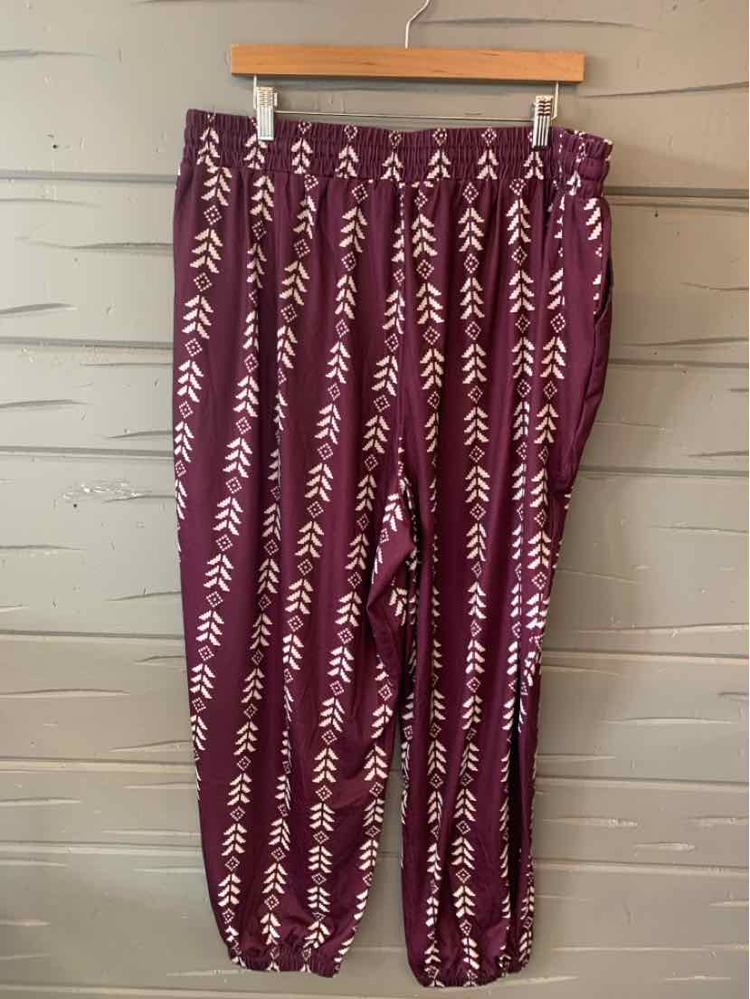 Burgundy lightweight pants with white vertical arrow patterns and elastic waistband and cuffs.