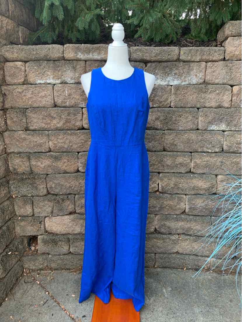 Sleeveless cobalt blue jumpsuit with wide legs and round neckline on white mannequin.