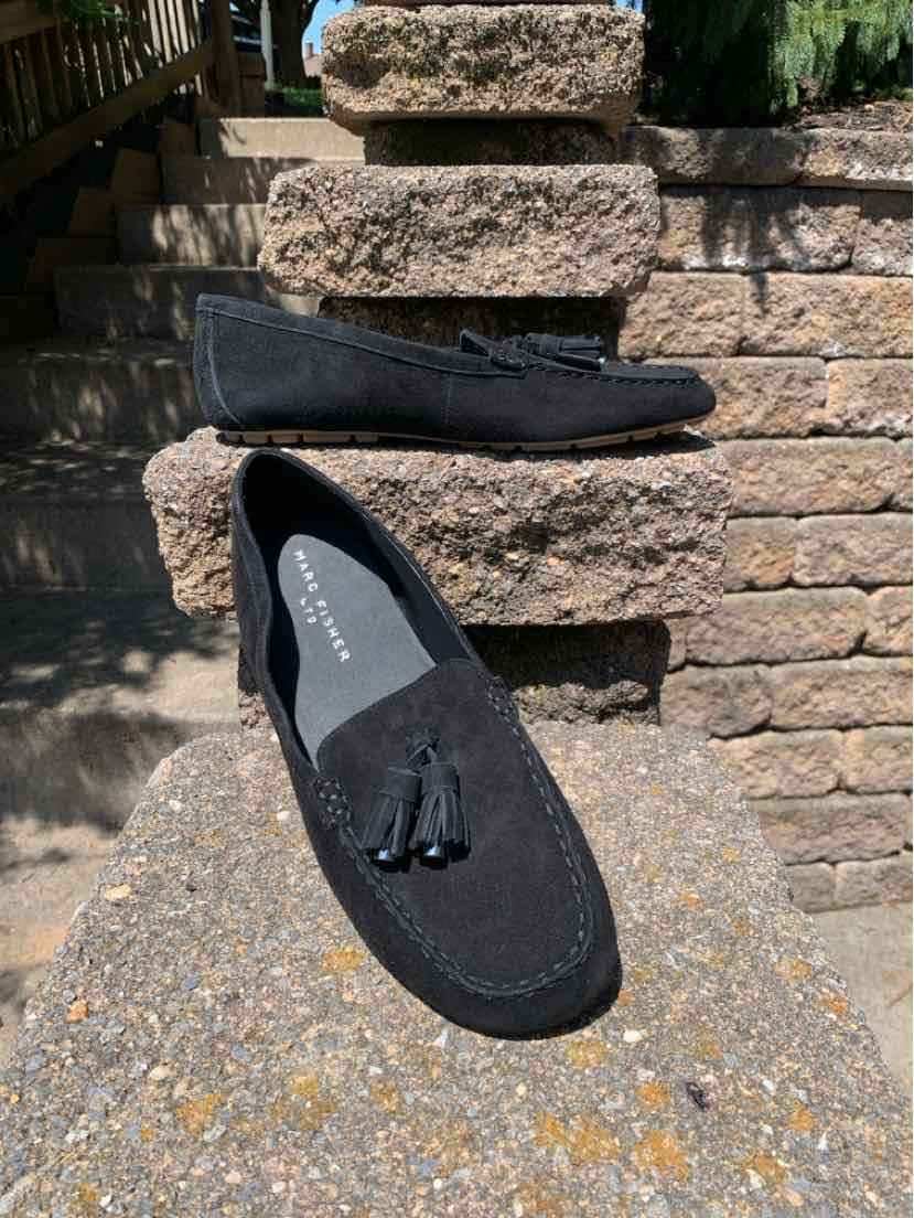 Black suede moccasin loafer with tassel detail and rounded toe, size 9.