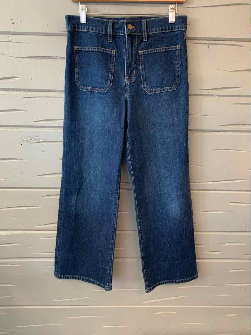 Blue denim cropped jeans with front patch pockets and a button closure, size 4P.