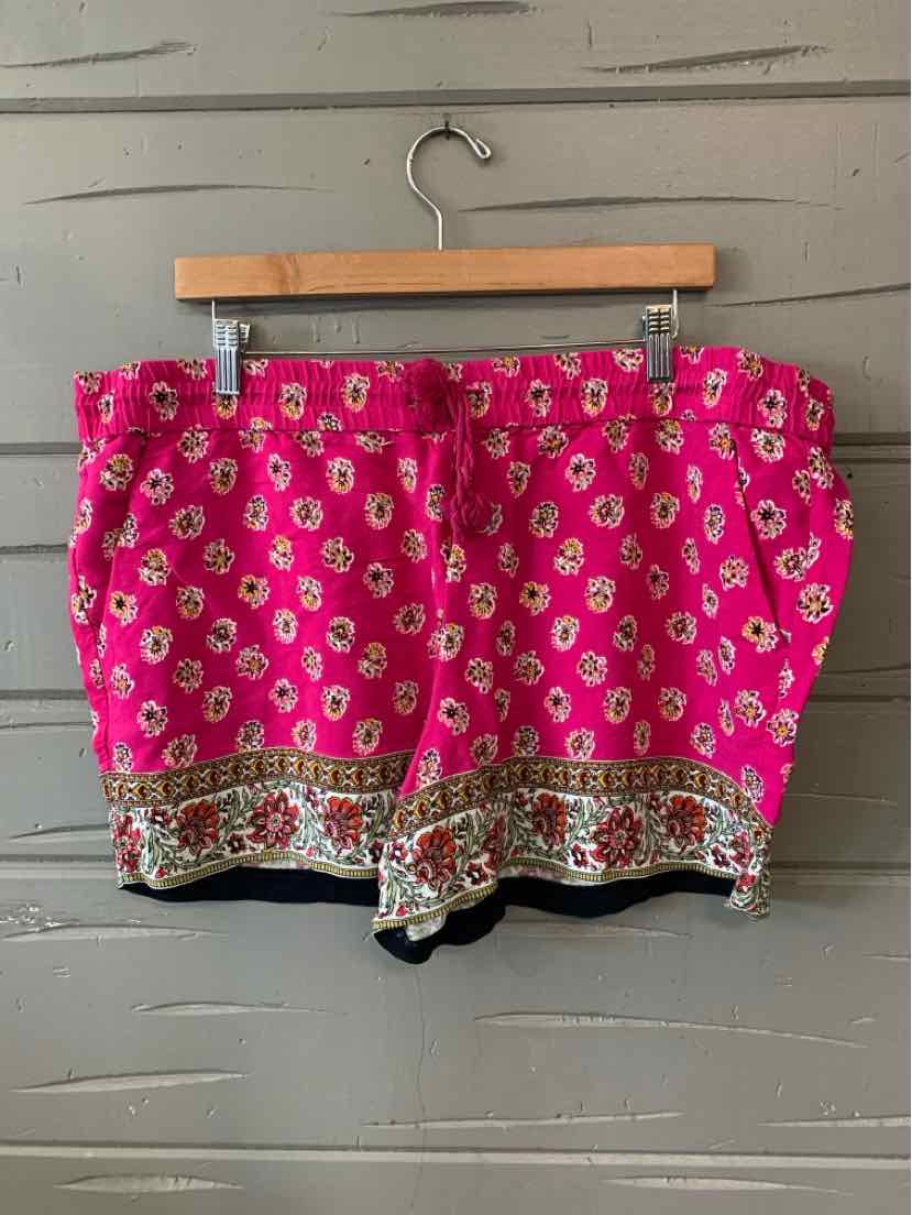 Pink floral shorts with white and yellow flower print and decorative patterned hem in XL size.