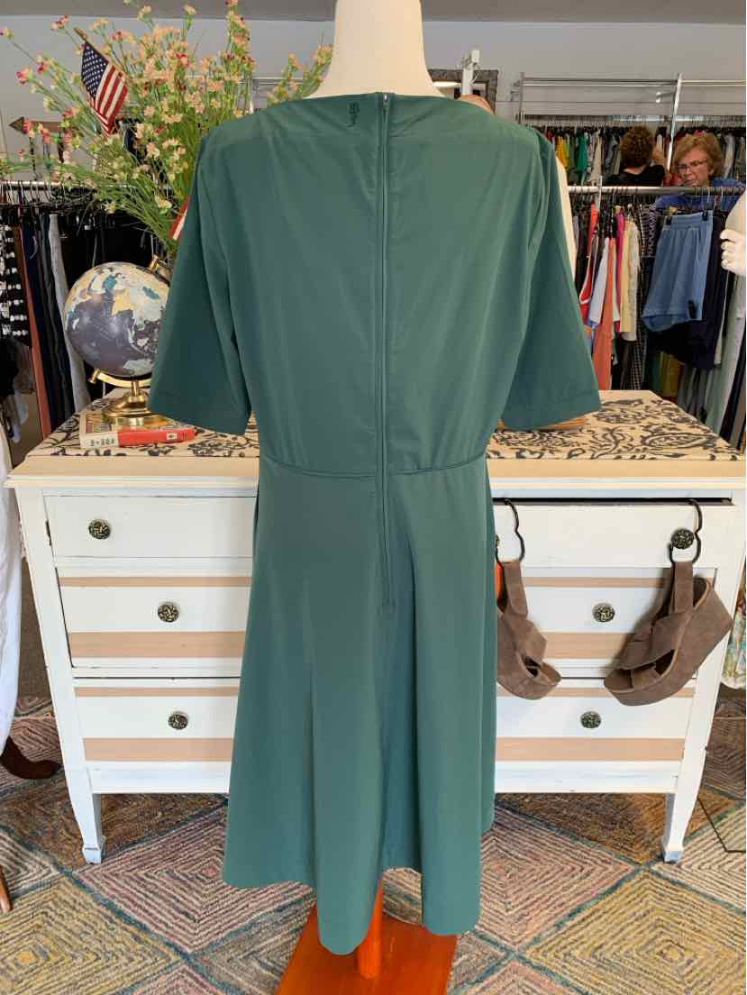 Dark green short-sleeve midi dress with a fitted waist and back zipper closure.