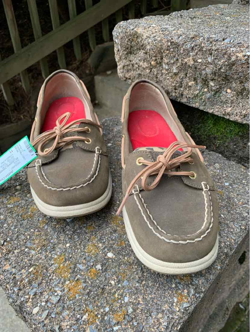 Brown leather boat shoes with tan laces and white soles, size 11, casual style.