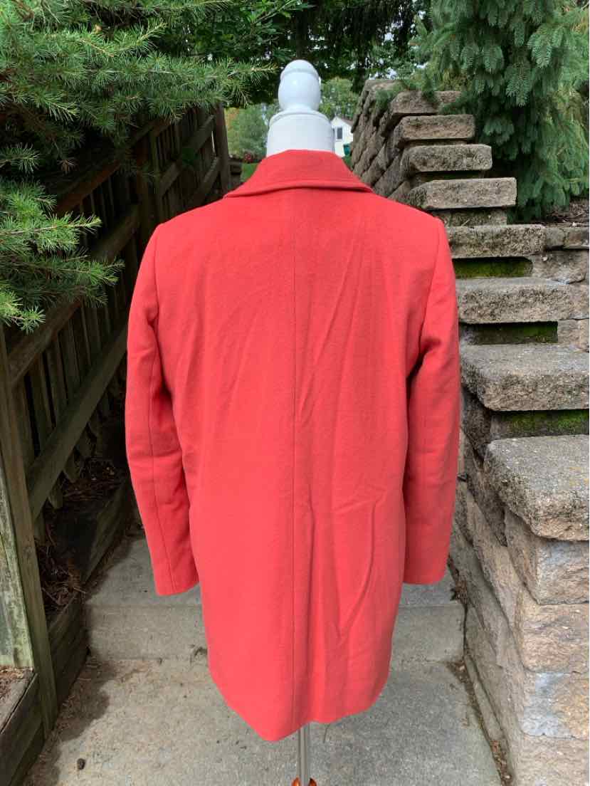 Solid red long-sleeve jacket with a straight fit, medium-weight fabric, and no visible patterns or embellishments.