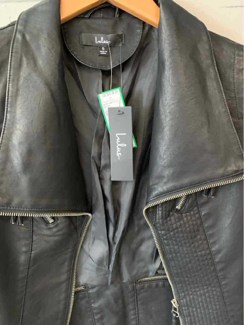 Black leather jacket with wide collar, silver zipper details, and textured side panels, size small.