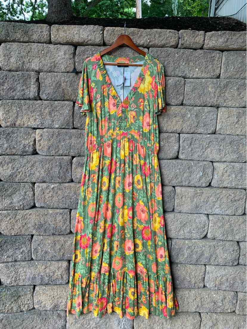 Green floral maxi dress with short sleeves and V-neckline, gathered waist detail.