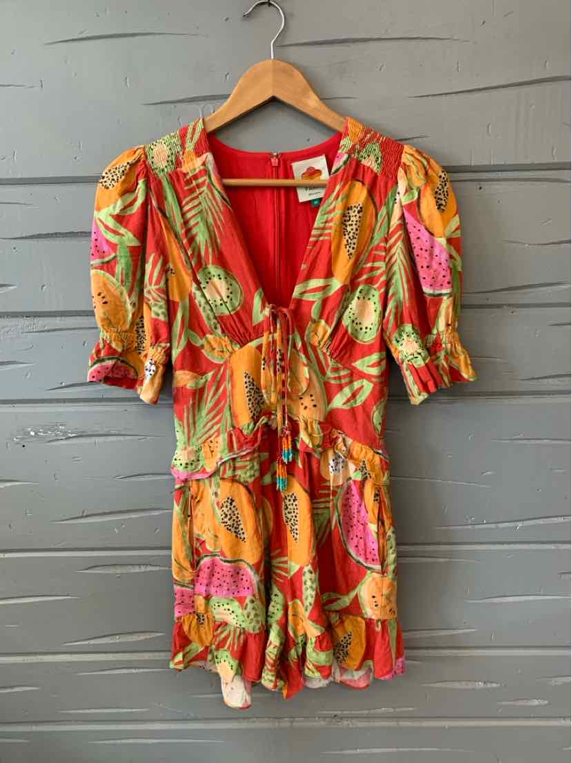 Orange tropical print romper with puff sleeves and V-neckline in size XS.
